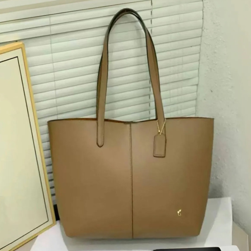 Cartera Coach de cuero para mujer.