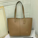 Cartera Coach de cuero para mujer.