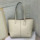 Cartera Coach de cuero para mujer.