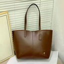 Cartera Coach de cuero para mujer.